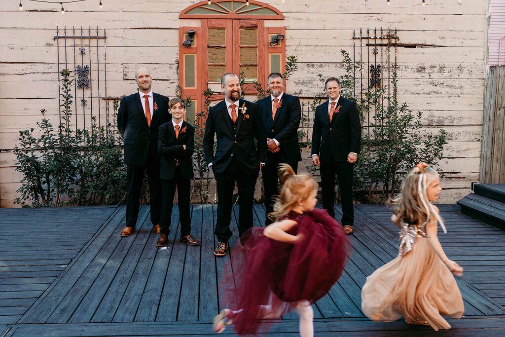 Groom and Groomsmen with flower girls at the Macarty house in New Orleans Bywater