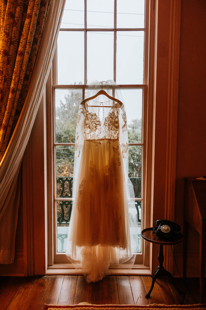 Wedding dress backlit by window