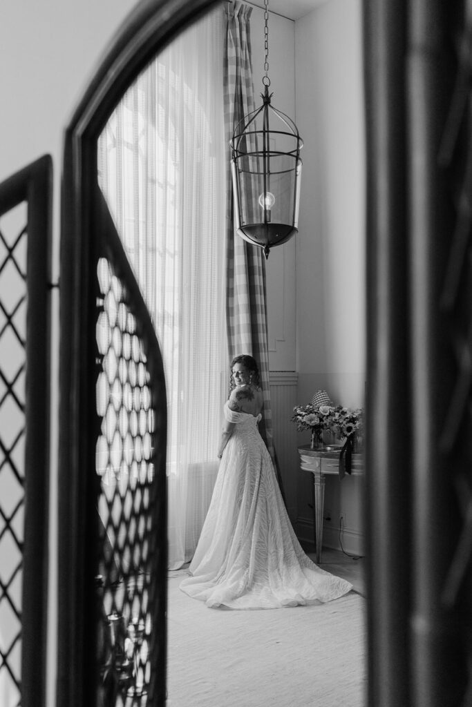 Black and white photo of gorgeous Bride in her getting ready hotel room at the Hotel Peter and Paul in New Orleans