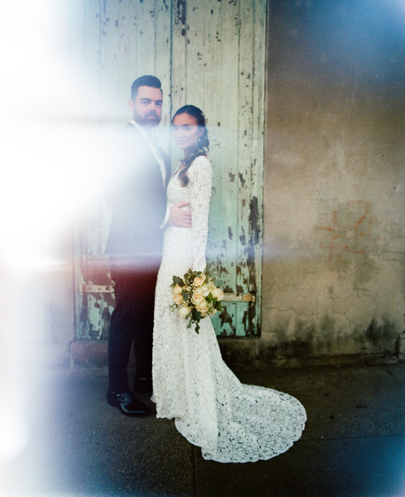Bride and Groom photographed with film photography showing light leaks.