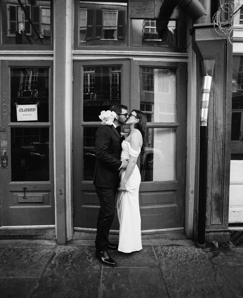 Bride and Groom Kissing, photographed with traditional film wedding photography in black and white.