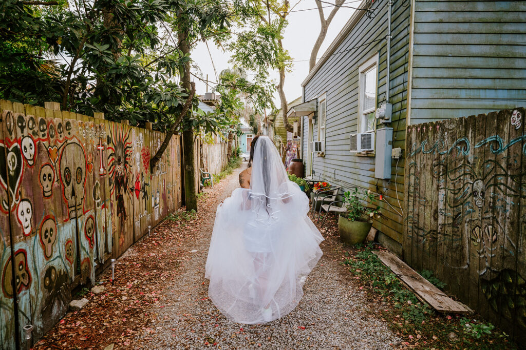 Bride walking in Voodoo Alley in New Orleans.
