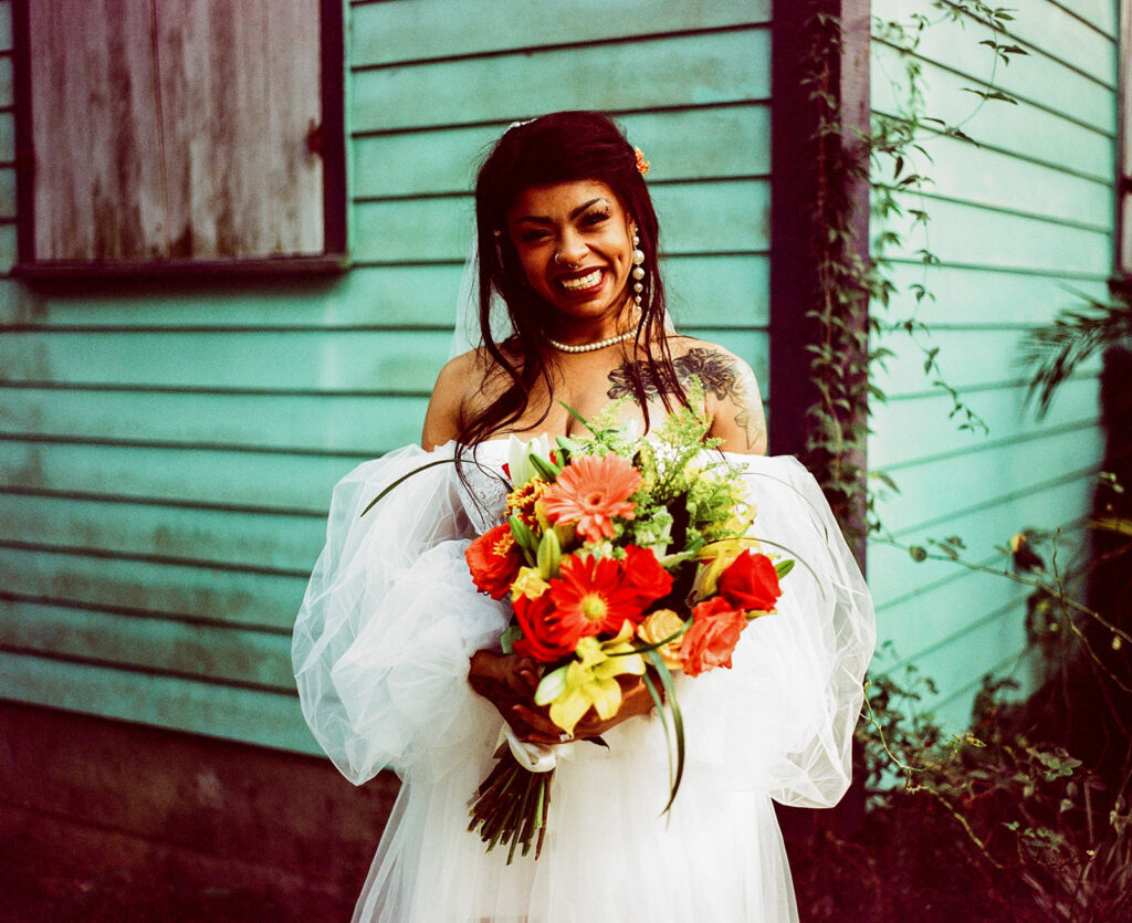 Bride in Voodoo Alley in New Orleans photographed with traditional film wedding photography.