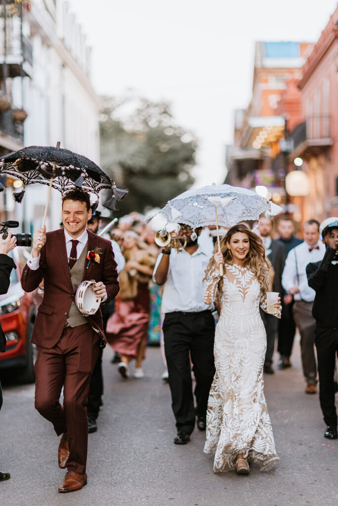 Couple during second line parade just outside at Wedding in The New Orleans Pharmacy Museum