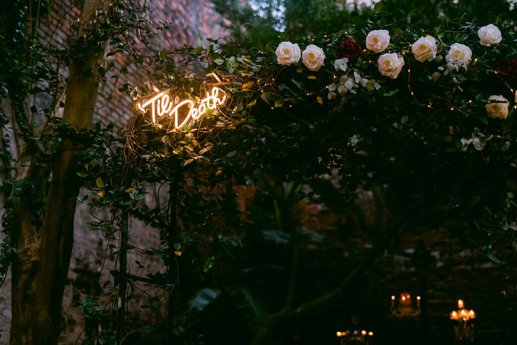 Neon and Florals at Wedding in The New Orleans Pharmacy Museum courtyard